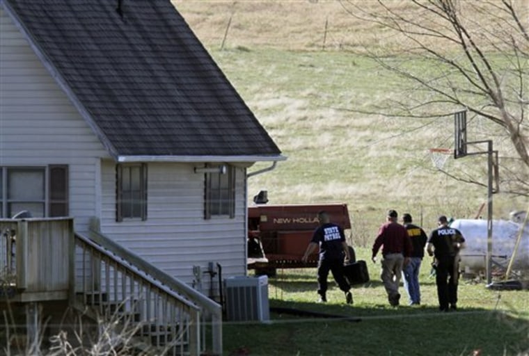 Investigators look for evidence on a rural property in western Missouri in Bates City, Mo., on Nov. 11. Bizarre allegations of rape, incest and bestiality in western Missouri led to the arrests of six family members last fall.
